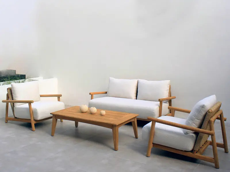 Wooden outdoor furniture set with white cushions on a neutral background
